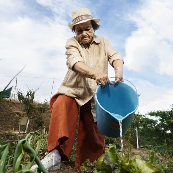 grandma-watering-plants-garden