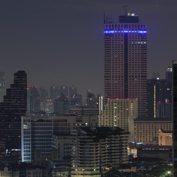 Timelapse of windows lights blinking in night Bangkok, Thailand